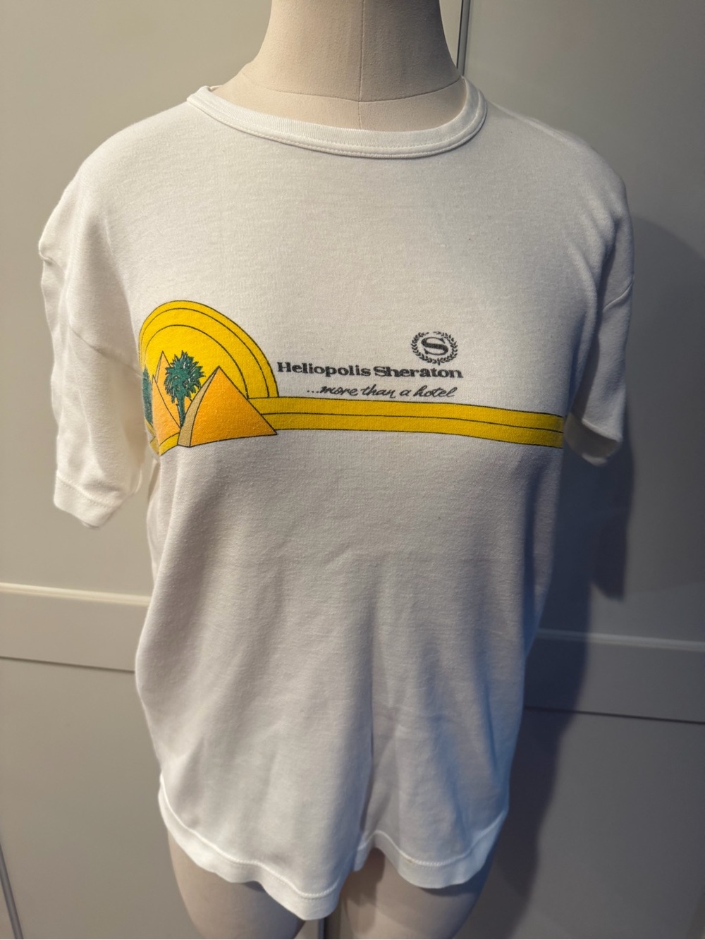 Vintage Heliopolis Sheraton White Graphic T-Shirt with Yellow Pyramid Design